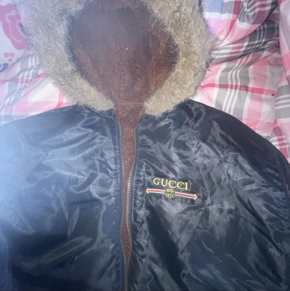 This is a Gucci reversible jacket it is black and brown it's a 2xlarge in size